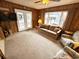 Inviting living room with wood paneling, comfortable seating and ample light at 6001-5117 S Kings Hwy., Myrtle Beach, SC 29575