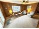Inviting living room with wood paneling, comfortable seating and ample light at 6001-5117 S Kings Hwy., Myrtle Beach, SC 29575