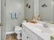 Clean bathroom with a white vanity, decorative elements, and a neutral color scheme at 604 Wilshire Ln. # 604, Murrells Inlet, SC 29576