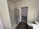 Clean bathroom features a glass shower, modern toilet, and sleek wood-look flooring at 624 Muster Field Ct., Conway, SC 29526