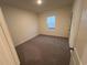 Comfortable bedroom with plush carpet, window view, and inviting space for relaxation at 624 Muster Field Ct., Conway, SC 29526