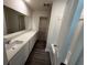 Bathroom with a long vanity, a large mirror, and a walk-in closet at 631 Muster Field Ct., Conway, SC 29526