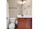 Well-lit bathroom with a wood vanity, white sink, and updated fixtures, offering a clean and modern aesthetic at 632 Serendipity Circle, Murrells Inlet, SC 29576
