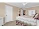 Bright bedroom featuring neutral walls, carpet, and white trim, creating a calm and inviting space at 632 Serendipity Circle, Murrells Inlet, SC 29576