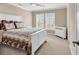 Bright bedroom featuring neutral walls, carpet, and white trim, creating a calm and inviting space at 632 Serendipity Circle, Murrells Inlet, SC 29576