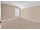 Neutral bedroom with carpet and natural light, showcasing a versatile space for personalization and comfort at 632 Serendipity Circle, Murrells Inlet, SC 29576