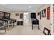 Spacious bonus room featuring pinball machines and memorabilia, perfect for entertainment and relaxation at 632 Serendipity Circle, Murrells Inlet, SC 29576