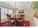 Elegant dining room with a round table, decorative rug, and a chandelier, perfect for Gathering gatherings and formal dinners at 632 Serendipity Circle, Murrells Inlet, SC 29576