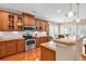 Bright kitchen with stainless steel appliances, wooden cabinets, and a cozy breakfast nook at 632 Serendipity Circle, Murrells Inlet, SC 29576