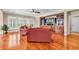 Bright living room with large windows, hardwood floors, and comfortable seating, ideal for relaxation and socializing at 632 Serendipity Circle, Murrells Inlet, SC 29576
