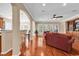 Open-concept living space with hardwood floors, seamlessly connecting the living room and dining area, perfect for modern living at 632 Serendipity Circle, Murrells Inlet, SC 29576