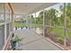 Spacious screened porch with views of the landscaped backyard, ideal for relaxing or entertaining guests outdoors at 632 Serendipity Circle, Murrells Inlet, SC 29576