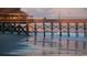 Beach scenery with birds on the beach and a pier in the background at 679 Riverwalk Dr. # 202, Myrtle Beach, SC 29579