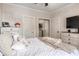 Bright bedroom with white linens, ceiling fan, and dresser at 679 Riverwalk Dr. # 202, Myrtle Beach, SC 29579