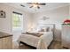 Bedroom showcasing natural light, a ceiling fan, and neutral decor at 679 Riverwalk Dr. # 202, Myrtle Beach, SC 29579