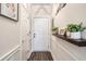 Charming entryway with dark wood-look flooring and decor, offering a warm welcome to the home at 679 Riverwalk Dr. # 202, Myrtle Beach, SC 29579