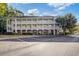 Inviting condo with a classic exterior, well-maintained landscaping, and convenient parking at 679 Riverwalk Dr. # 202, Myrtle Beach, SC 29579