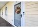 Inviting front entrance featuring a modern glass door and stylish autumn wreath decoration at 679 Riverwalk Dr. # 202, Myrtle Beach, SC 29579
