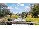 Picturesque view of a community waterway with bridge and lush green landscaping at 679 Riverwalk Dr. # 202, Myrtle Beach, SC 29579
