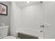 Modern bathroom features white subway tile, a shower-tub combination, and clean fixtures at 7200 Ocean Blvd. N # 664, Myrtle Beach, SC 29572