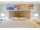 Bedroom showcases a comfy bed with a decorative ocean-themed art piece above the headboard at 7200 Ocean Blvd. N # 664, Myrtle Beach, SC 29572
