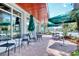 Outdoor cafe seating under green umbrellas, inviting guests to enjoy refreshments in a relaxed setting at 7200 Ocean Blvd. N # 664, Myrtle Beach, SC 29572