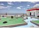 Fun mini golf course with obstacles and ocean views, set on the building's rooftop at 7200 Ocean Blvd. N # 664, Myrtle Beach, SC 29572