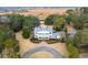 Stunning aerial view of estate featuring manicured landscaping, circular driveway, and a beautiful home at 741 Tuckers Rd., Pawleys Island, SC 29585