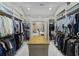 Large walk-in closet with ample storage space and a center island for organizing accessories at 741 Tuckers Rd., Pawleys Island, SC 29585