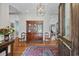 Elegant foyer with hardwood floors, decorative cabinet, and refined details throughout at 741 Tuckers Rd., Pawleys Island, SC 29585