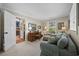 Comfortable office featuring a wooden desk, a sofa, and a doorway into the bar area at 741 Tuckers Rd., Pawleys Island, SC 29585