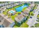 Gorgeous community with a pool, parking, pond, and landscaped greenery in an aerial view at 8570 Hopkins Circle # D, Surfside Beach, SC 29575