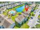 Gorgeous community with a pool, parking, pond, and landscaped greenery in an aerial view at 8570 Hopkins Circle # D, Surfside Beach, SC 29575