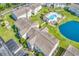 Scenic aerial view of condo complex with a pool, parking, well-manicured greenery and a beautiful pond at 8570 Hopkins Circle # D, Surfside Beach, SC 29575