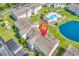Scenic aerial view of condo complex with a pool, parking, well-manicured greenery and a beautiful pond at 8570 Hopkins Circle # D, Surfside Beach, SC 29575