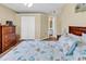Bright bedroom featuring a double closet, light walls, and hardwood floors at 8570 Hopkins Circle # D, Surfside Beach, SC 29575