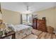 Traditional style bedroom featuring a ceiling fan, television, and wood grain furniture at 8570 Hopkins Circle # D, Surfside Beach, SC 29575