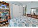 Cozy bedroom with coastal-inspired decor, closet, and an en suite bathroom at 8570 Hopkins Circle # D, Surfside Beach, SC 29575