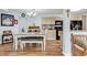 Bright dining room showcases the open floor plan, and views of the kitchen with neutral cabinetry and black appliances at 8570 Hopkins Circle # D, Surfside Beach, SC 29575