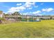 Inviting community featuring well-maintained lawns, a serene pond, and charming residential buildings on a sunny day at 8570 Hopkins Circle # D, Surfside Beach, SC 29575