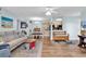 Inviting living room showcases an open floor plan with sleek hard wood floors, modern décor, and stylish furnishings at 8570 Hopkins Circle # D, Surfside Beach, SC 29575