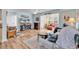 Open concept living room featuring hardwood floors, a fireplace, and comfortable seating at 8570 Hopkins Circle # D, Surfside Beach, SC 29575