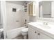 Bright bathroom featuring a tub-shower combo, vanity with storage, and neutral finishes at 86 Beaver Pond Loop # 33, Pawleys Island, SC 29585