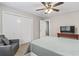 Well-lit bedroom with ceiling fan, large closet, and light-colored walls with carpet at 86 Beaver Pond Loop # 33, Pawleys Island, SC 29585