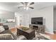 Spacious living room with hardwood floors, fireplace and large TV, perfect for entertaining guests at 86 Beaver Pond Loop # 33, Pawleys Island, SC 29585