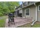 Back patio area featuring a grill, brick pavers, and view of the home's exterior at 86 Beaver Pond Loop # 33, Pawleys Island, SC 29585