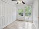Bright sun room with ceramic tile, large window, exterior door, and view of backyard at 86 Beaver Pond Loop # 33, Pawleys Island, SC 29585