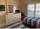 Twin bedroom offers a comfortable space with matching furniture and a large window view at 1000 Ray Costin Way # 114, Murrells Inlet, SC 29576