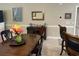 Dining area with a wooden table, seating for six, and views of the living space at 1000 Ray Costin Way # 114, Murrells Inlet, SC 29576