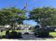 Scenic view of the community fountain surrounded by lush trees and manicured grounds at 1000 Ray Costin Way # 114, Murrells Inlet, SC 29576